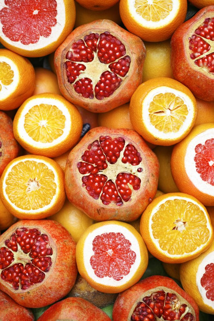 pexels-photo-1435735-1435735 Colorful mix of sliced citrus fruits and pomegranates showcasing freshness.